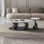 MODERN MARBLE OVAL CENTER TABLE WITH SCULPTURAL METALLIC BASE DESIGN