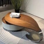 MODERN SCULPTURAL WOOD AND METAL CENTER TABLE