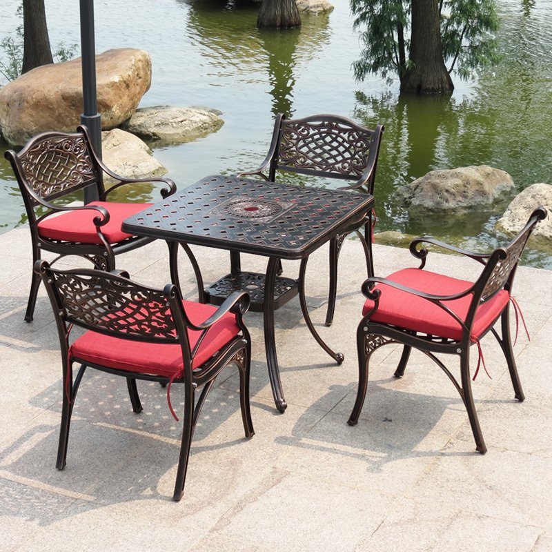 red dining set ROYAL HERITAGE CAST ALUMINUM OUTDOOR DINING SET WITH RED CUSHIONED CHAIRS - Image 1