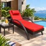 MODERN CURVED WICKER OUTDOOR CHAISE LOUNGE WITH VIBRANT RED CUSHION