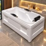 MODERN FREESTANDING ACRYLIC BATHTUB WITH INTEGRATED GRAB BARS AND PILLOW
