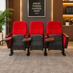 RED THREE-SEATER AUDITORIUM AND CINEMA CHAIRS WITH WRITING TABLETS